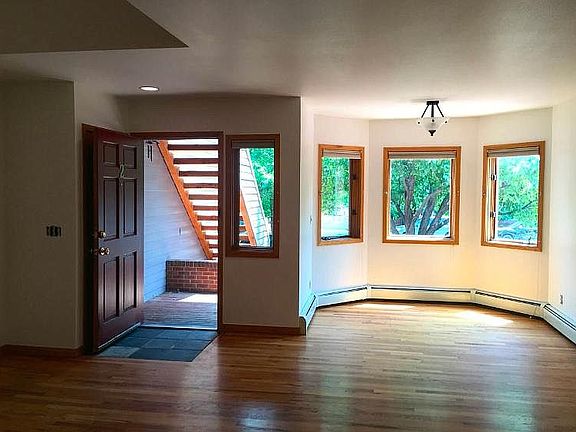 South facing living room windows, making for pleasant natural lighting.