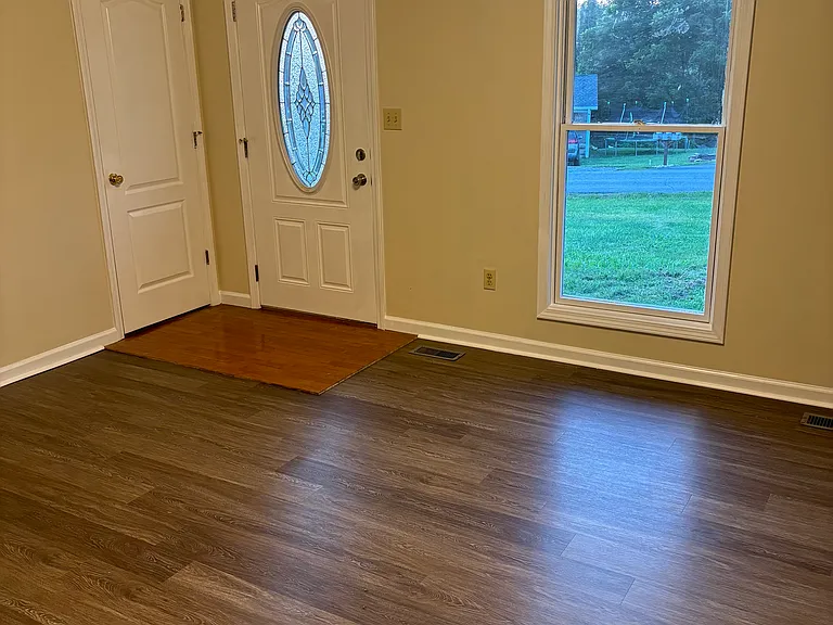 Living room with entry closet