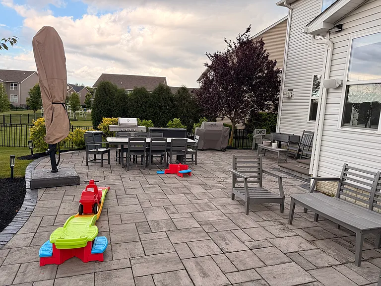 HUGE FINISHED PATIO WITH PAVERS AND GAS FIRE PLACE