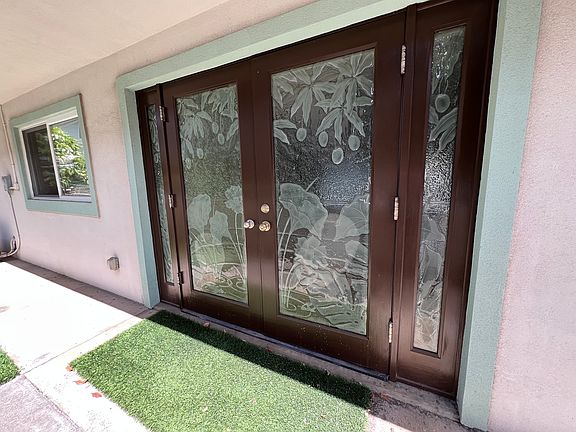 Beautify custom glass details on left entry doors.