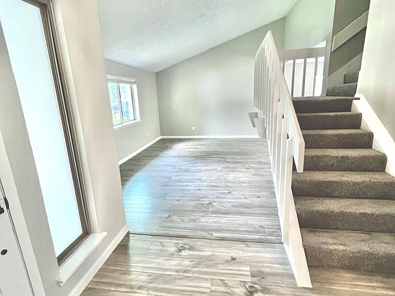Open floorplan has great flow, unique architecture, and features two separate living areas downstairs. All new paint 2022