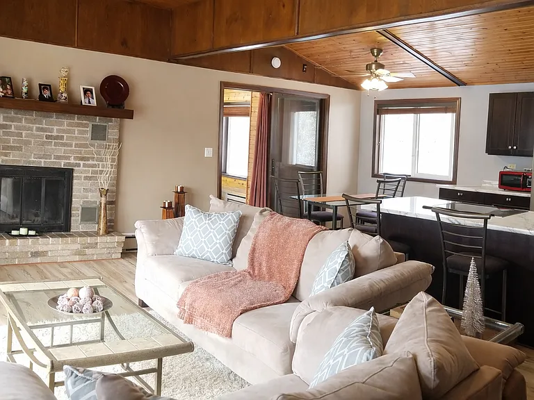 Open living area with fireplace and patio door