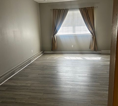 Large den or family room with ceiling fan.