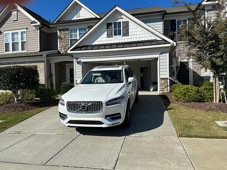 Front of house, with two car garage and two car drive way.