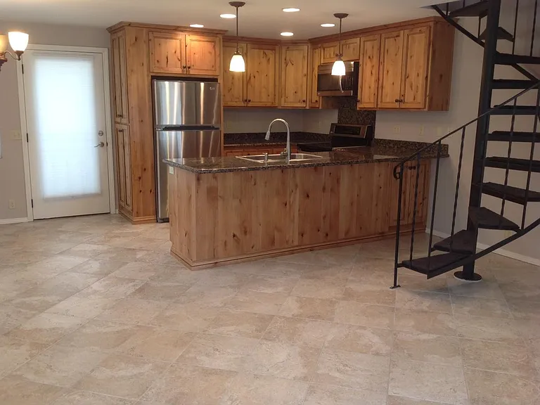 Updated Kitchen with granite countertops and stainless appliances.