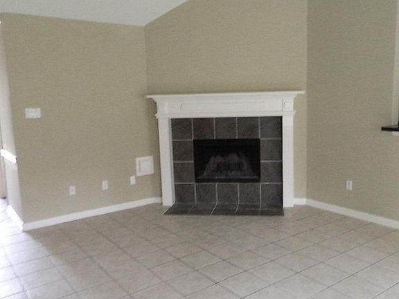 High ceilings and crown molding make this home a standout. Corner gas log fireplace.