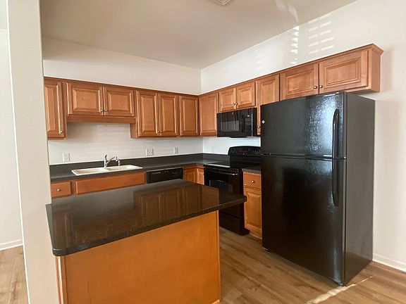 kitchen area, all appliances included and seating for two at island