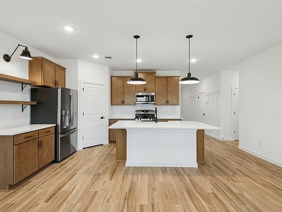 Kitchen with stylish floating shelves