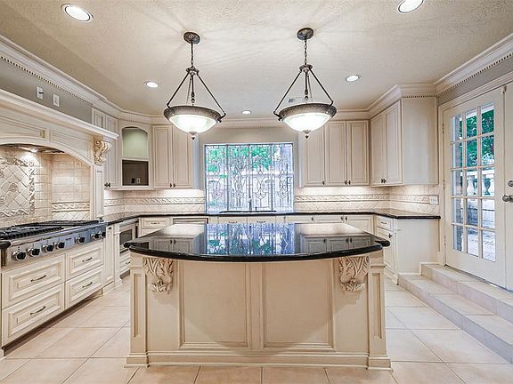 Chef's kitchen has lots of storage and plenty of work space. This is a kitchen to not only cook in but to entertain and create in.