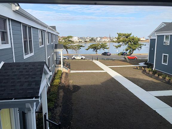 view from living room, looking at Deal Lake. Grounds have been newly landscaped