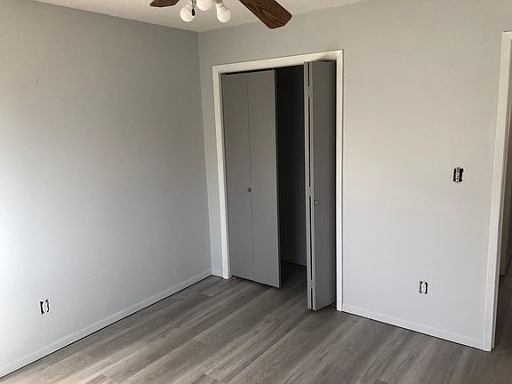 13x13 Second Bedroom with closet and ceiling fan.