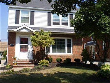 Front View nicely Landscaped and newer Storm Door