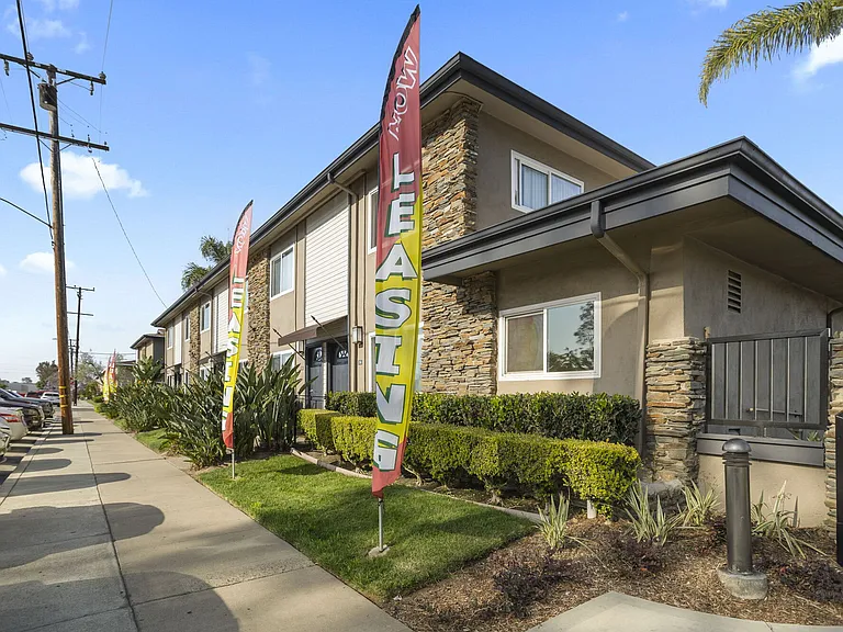 Community entrance at Olive Tree Townhomes in Costa Mesa, CA