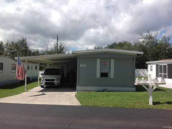 Front of Home with Attached Carport