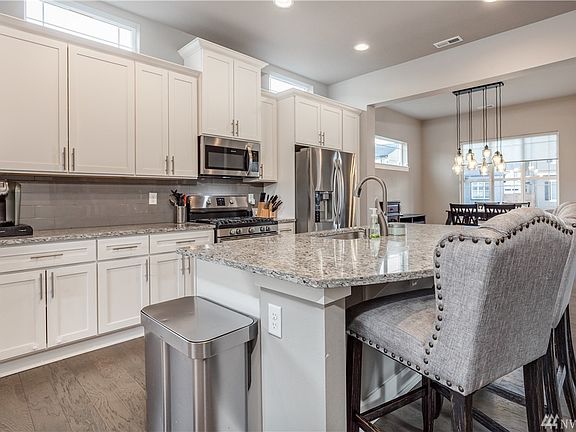 Stainless steel appliances including 5-burner gas range