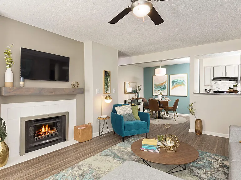 Open Living Room featuring a Modern Gas Fireplace with Mantle - Diamond Interior