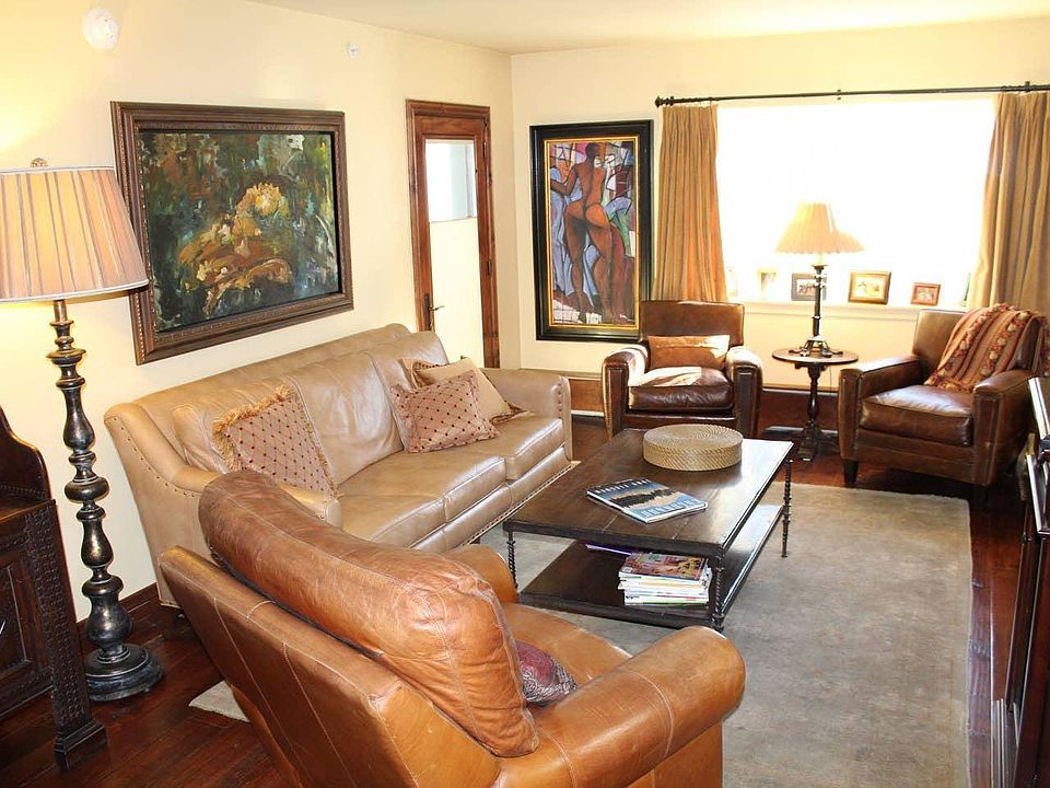 Living Room~ Wine cooler, cable, fireplace, access to balcony and board game cabinet.