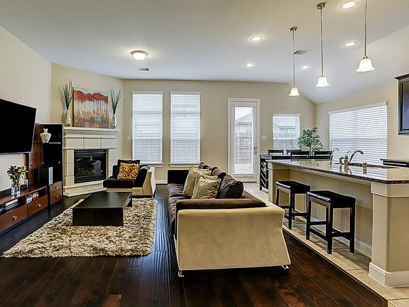 Another view of the living room from the dining room shows the open feel and the abundance of natural light!