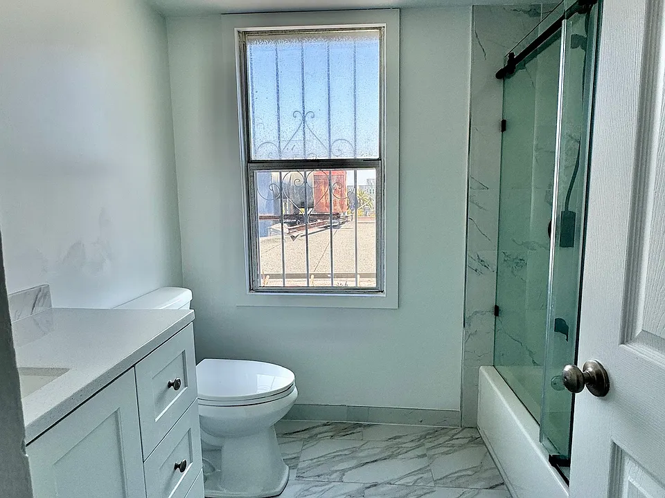 Brand new renovated bathroom with shower/tub combo and new fixtures