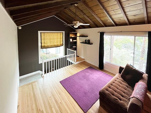 Original oak hardwood floors reveal tones of olive and rose. Gorgeous! Beamed ceilings with Casablanca fan for summer or winter (It reverses). Energy efficient!