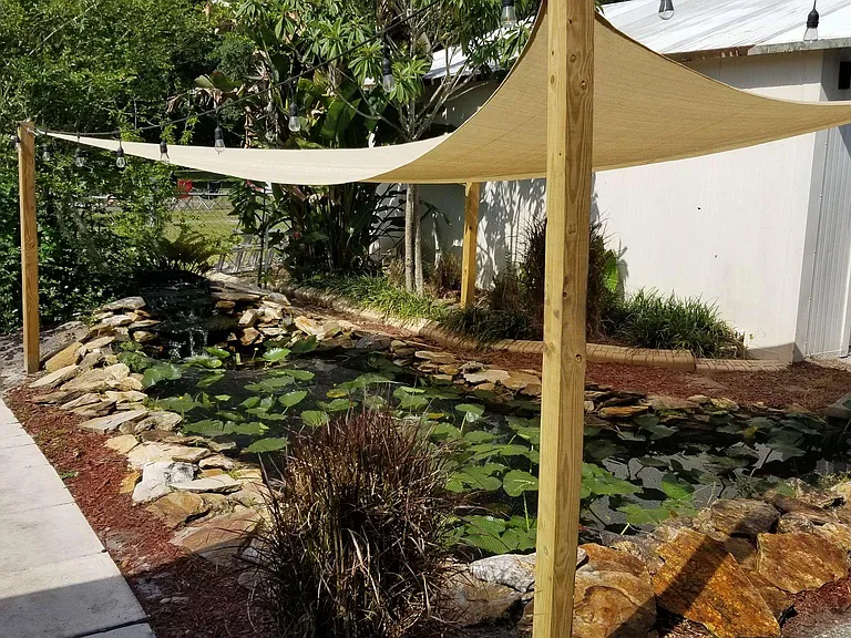 Fully stocked Koi Pond with relaxing water fall. Sit on your large porch and enjoy!