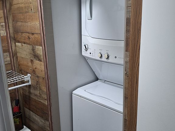 Private stackable washer and dryer, iron and ironing board all located in your closet