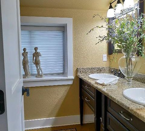 Bathroom with double sinks - granite top
