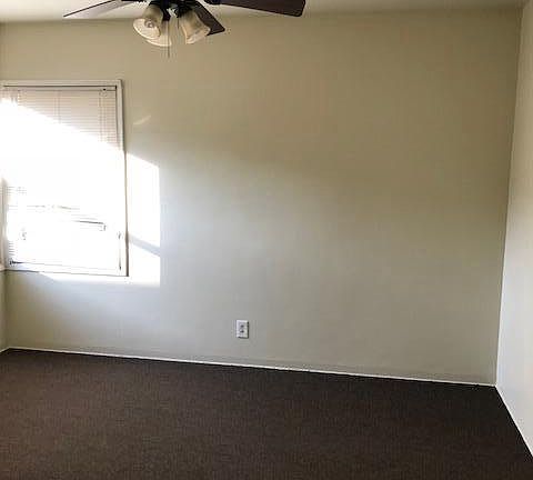 Bedroom with ceiling fan - newly carpeted