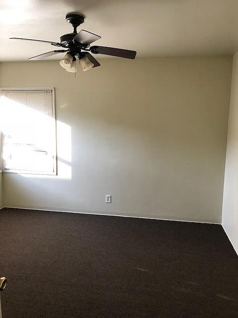 Bedroom with ceiling fan - newly carpeted