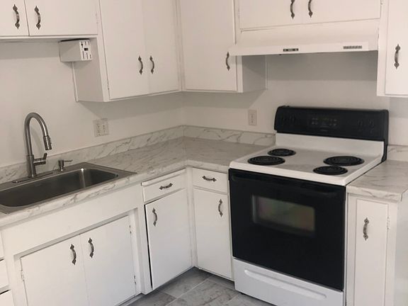 Newer tile floors and newer refrigerator.