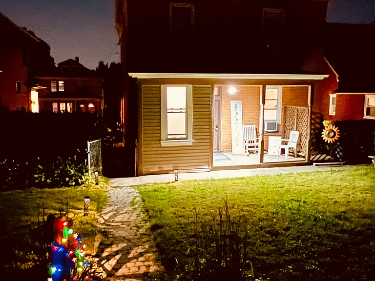 Lit path to the house at night