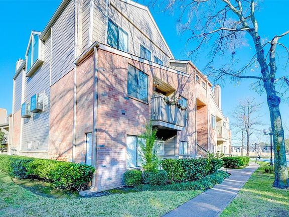 Corner, downstairs unit with lush landscaping