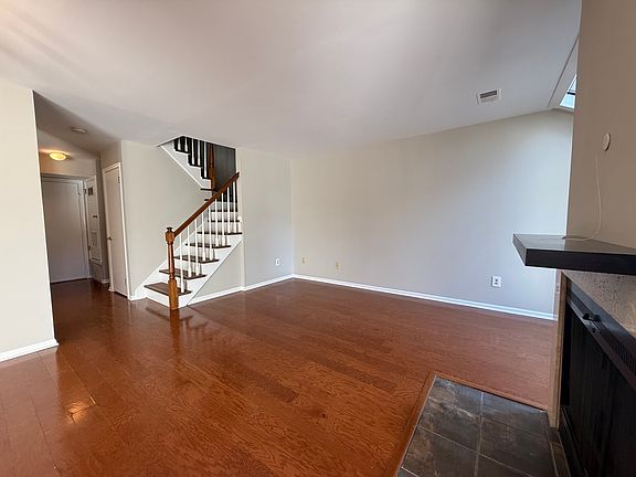 open floor dining room/living room floor plan. wood burning fireplace.
