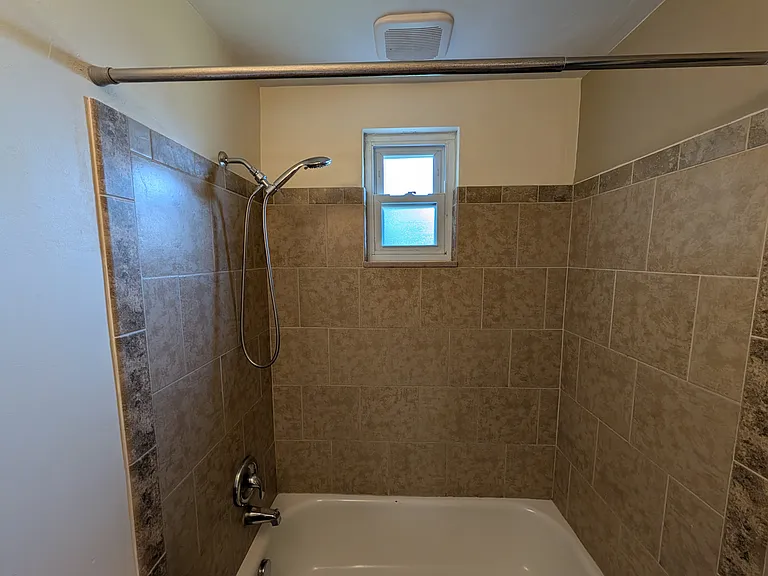 newly tiled bathtub surround