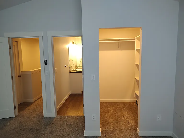 Bedroom 1 facing closet, bathroom and hallway