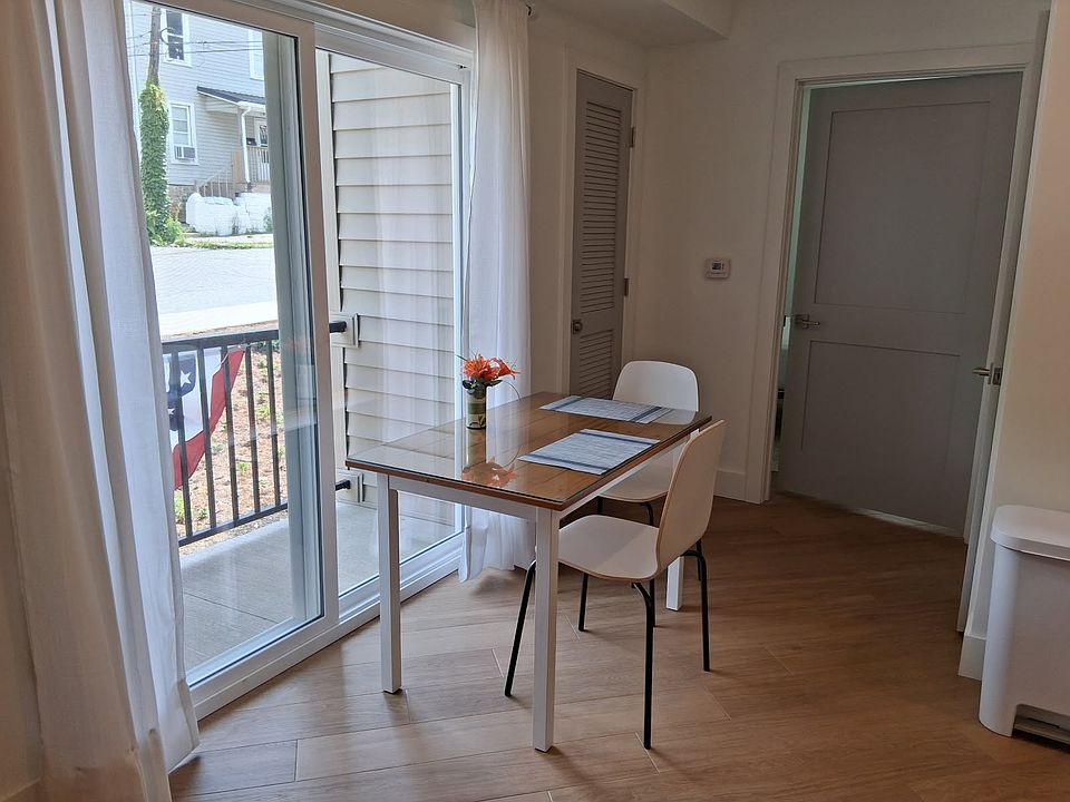 Two seat dining table near the small outdoor patio