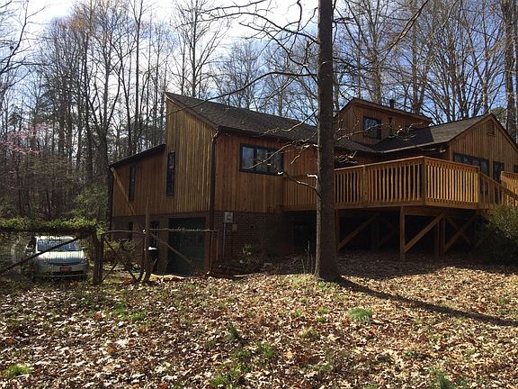 Another view from the back yard in the winter. The garage is visible on the lower level.
