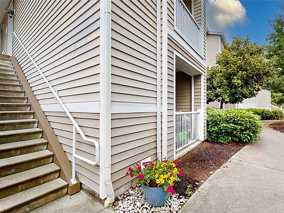 Staircase leading up to the upper-level unit>