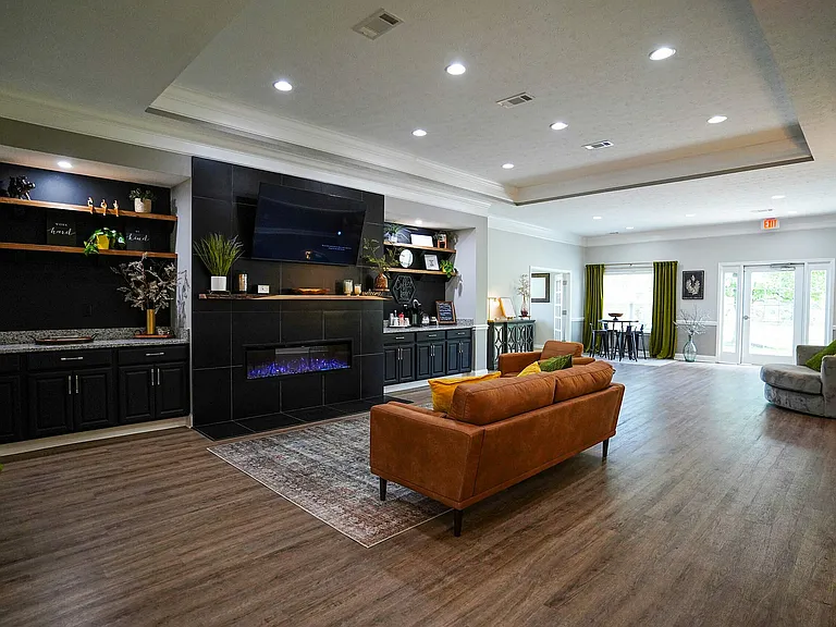 Meet your neighbors or just kick back in the clubhouse _ complete with comfy seating, a coffee bar, TV, and gas fireplace to make it feel like home (just a little bigger).