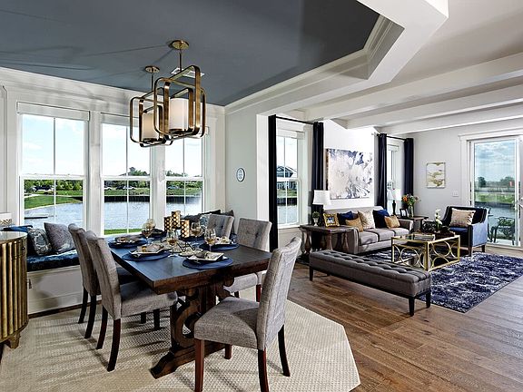 A view of a dining room and living room in a Dillon villa at Heritage Shores.