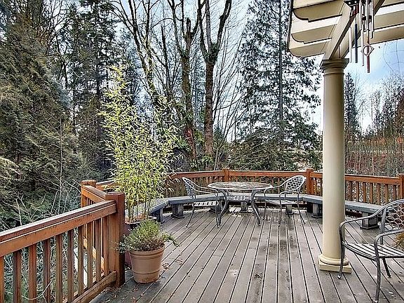 Trex deck wraps around back and side of home.