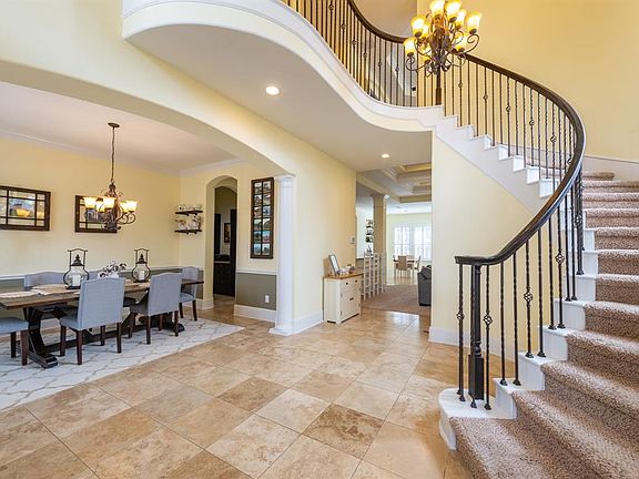 Front foyer with dining and grand staircase