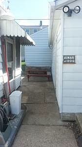 Sidewalk going to rear of house