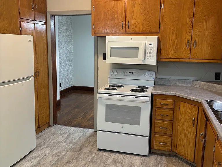 Kitchen incldes new range, new microwave and dishwasher