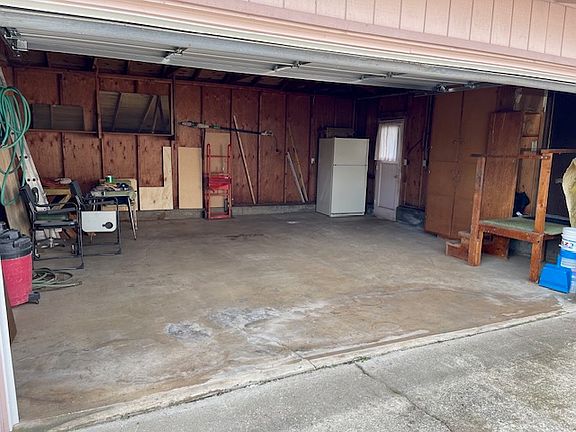 Large 2-car garage with storage and garage fridge