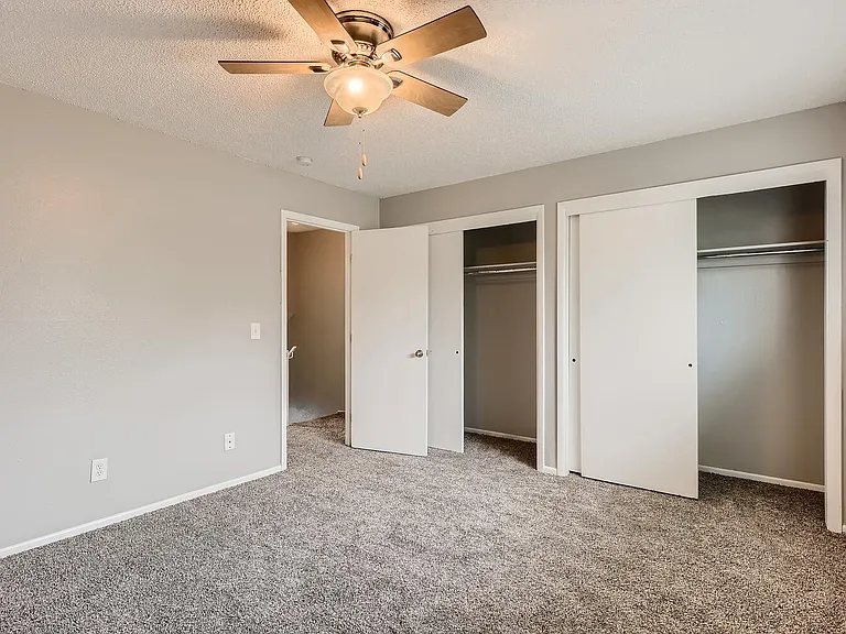 A Bedroom with a large closet at Alder Square Rental Townhomes
