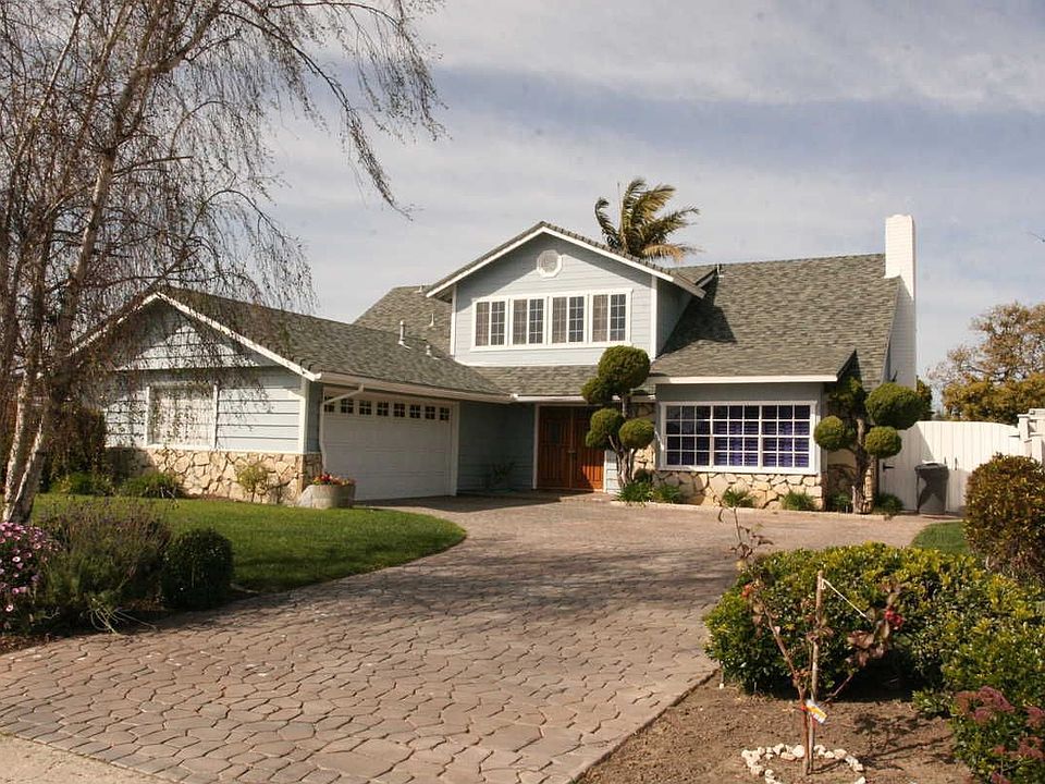 Colonial Cape Cod with stamped concrete driveway