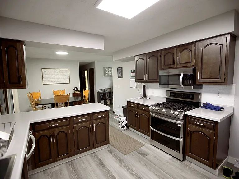 Kitchen - Double Oven & Over the Range Microwave. Dining Room in background