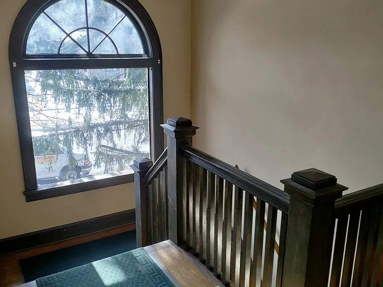 front foyer leading up to the second floor apartment
