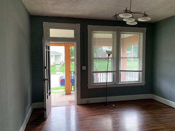 Living room looking at front door and street.